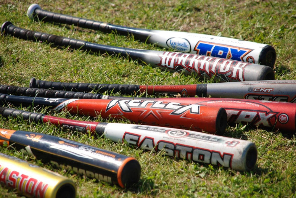 Baseball bats lying on the grass