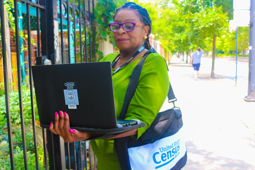 A government employee canvasses for the 2020 U.S. census