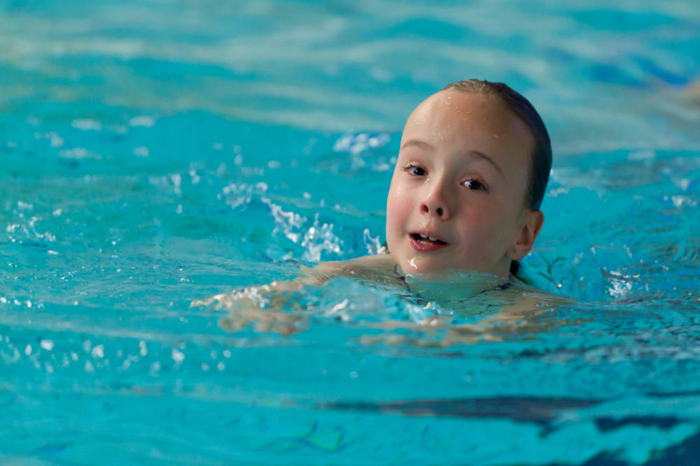 A child learning to swim