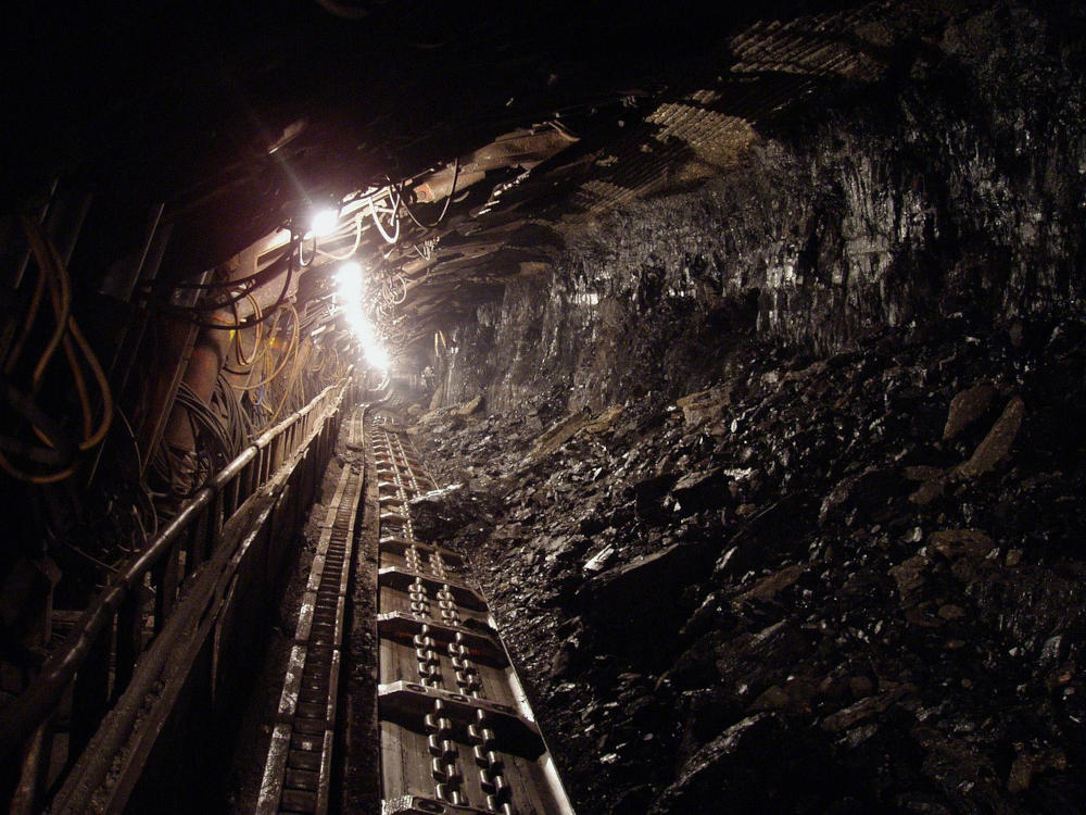 A coal mining tunnel with a conveyor belt