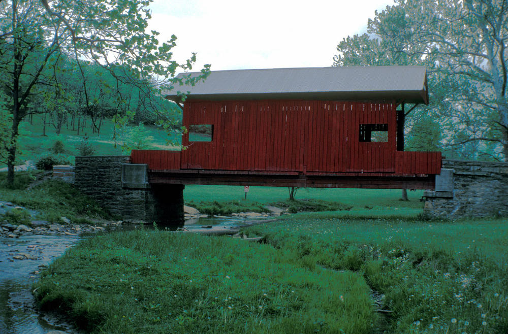 The Ebenezer Covered Bridge in Mingo Creek COunty Park is painted barn red.