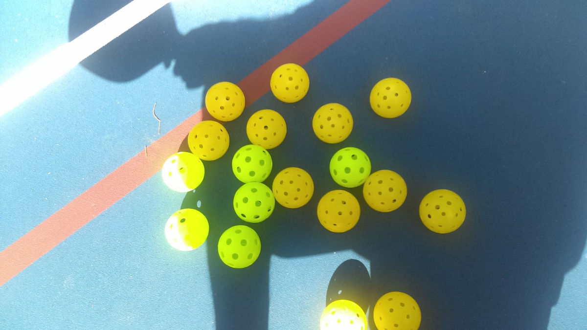 Balls that look like whiffle balls are used to play pickleball